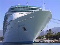 Same Cruise Ship towering over <i>Warrior</i>